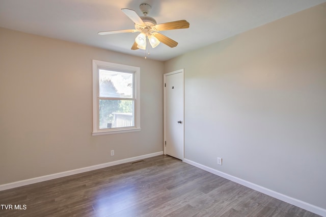 unfurnished room featuring ceiling fan and hardwood / wood-style floors