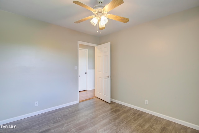 unfurnished room featuring ceiling fan and hardwood / wood-style flooring