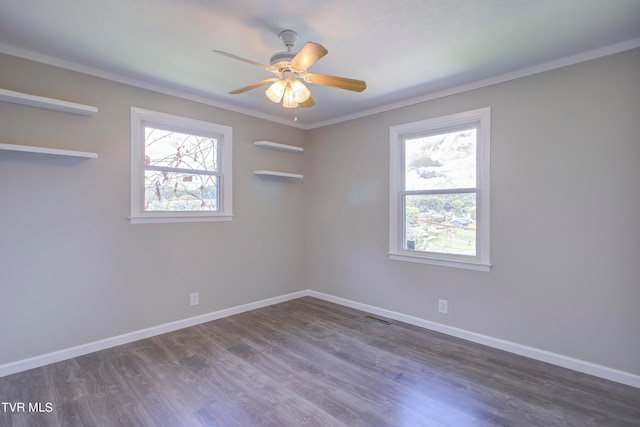 unfurnished room featuring ornamental molding, dark wood-type flooring, and ceiling fan