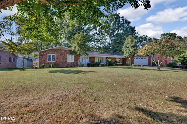 ranch-style home featuring a garage and a front lawn