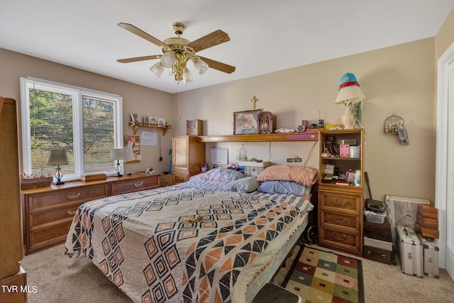 bedroom featuring light carpet and ceiling fan