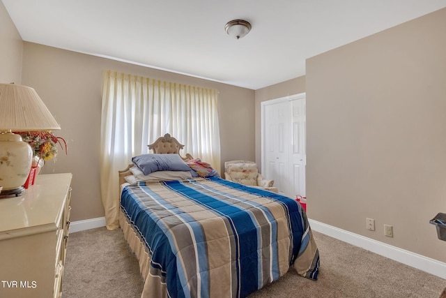 bedroom featuring light carpet and a closet