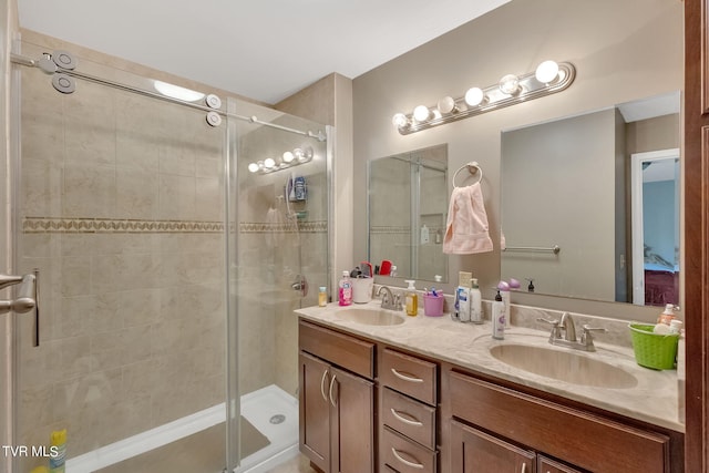 bathroom with walk in shower and vanity