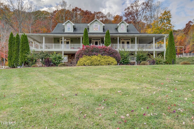 farmhouse-style home with a front lawn