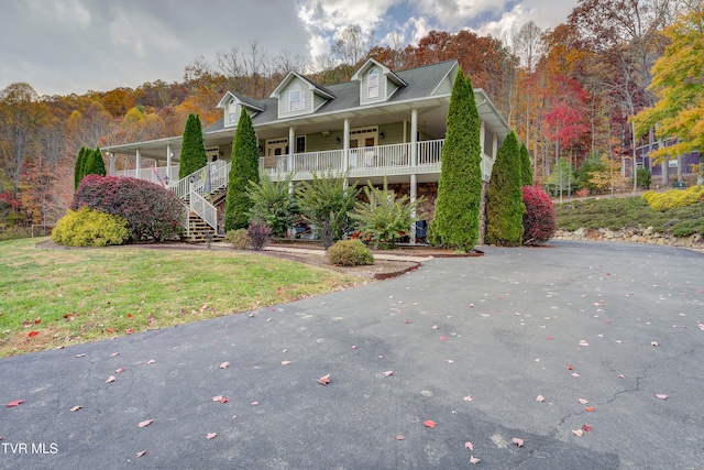 view of front of home with a front lawn and a porch