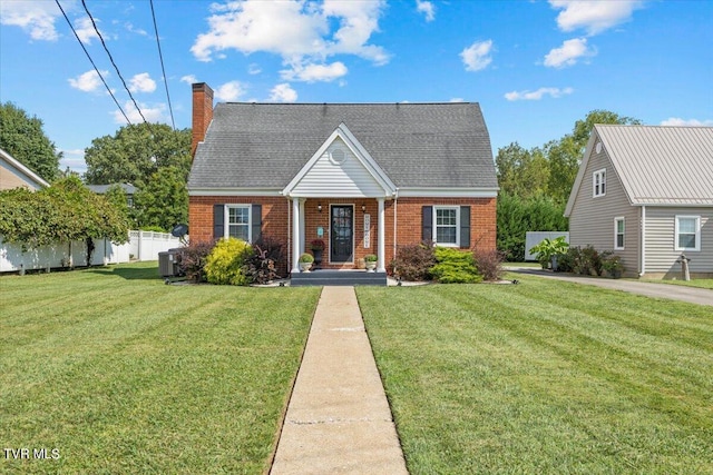 bungalow-style home with a front yard