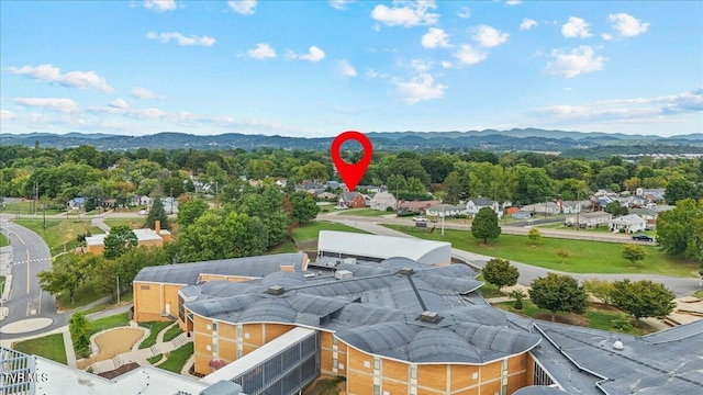 birds eye view of property featuring a mountain view