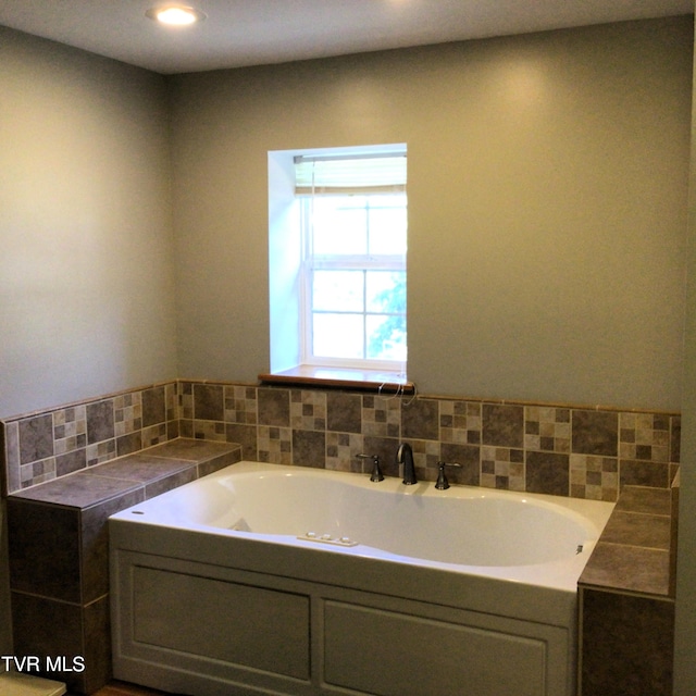 bathroom with a tub