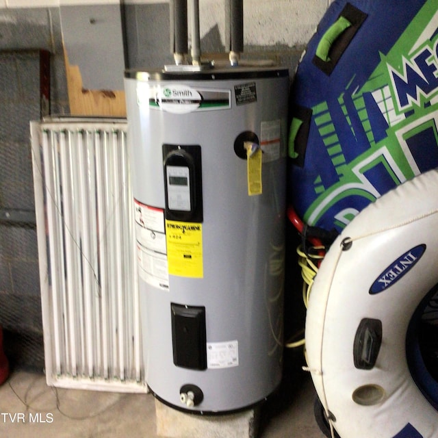 utility room featuring electric water heater