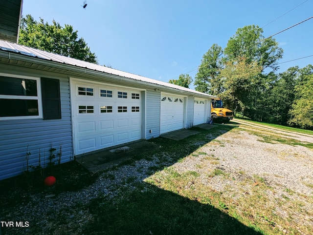 garage featuring a yard