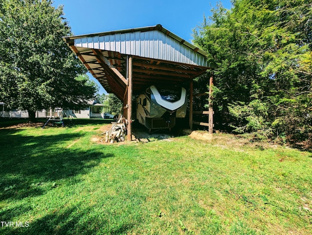 view of outbuilding featuring a lawn