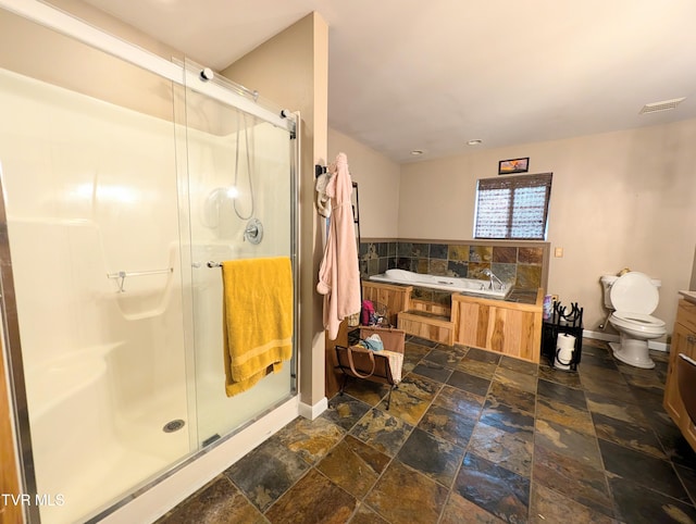 full bathroom with separate shower and tub, vanity, and toilet