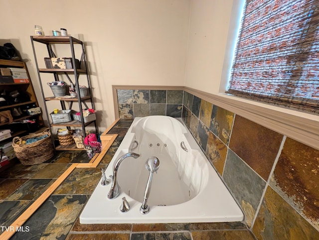 bathroom featuring a relaxing tiled tub