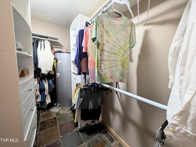 walk in closet featuring gas water heater