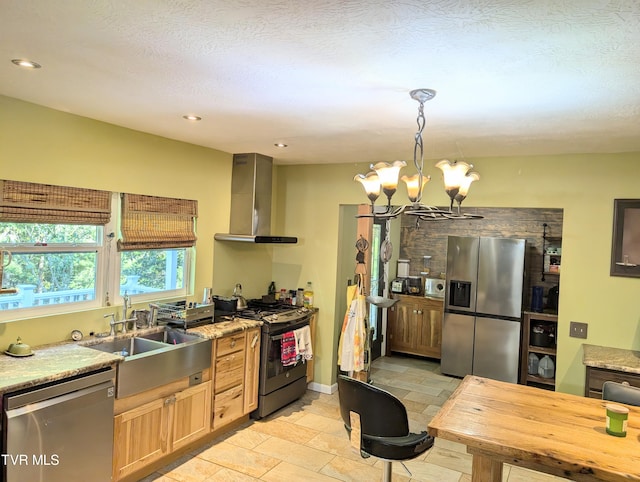 kitchen featuring pendant lighting, stainless steel appliances, an inviting chandelier, sink, and extractor fan