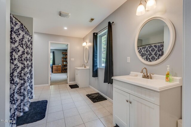 bathroom featuring tile patterned floors and vanity