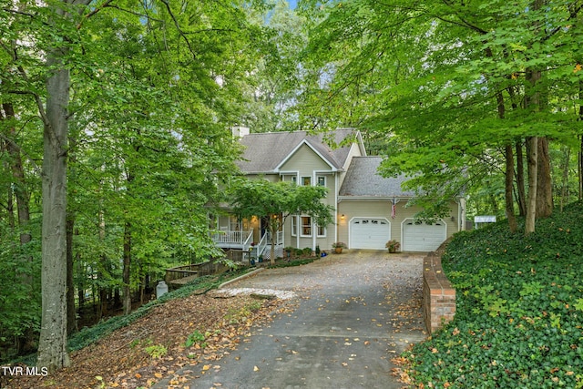 376 Cain Dr, Blountville, TN 37617 - view of front of property with driveway, covered porch, a garage, and roof with shingles
