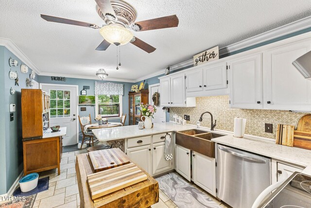 kitchen with kitchen peninsula, dishwasher, ceiling fan, and white cabinetry