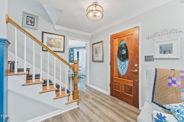 376 Cain Dr, Blountville, TN 37617 - foyer entrance with wood finished floors, ornamental molding, and stairway