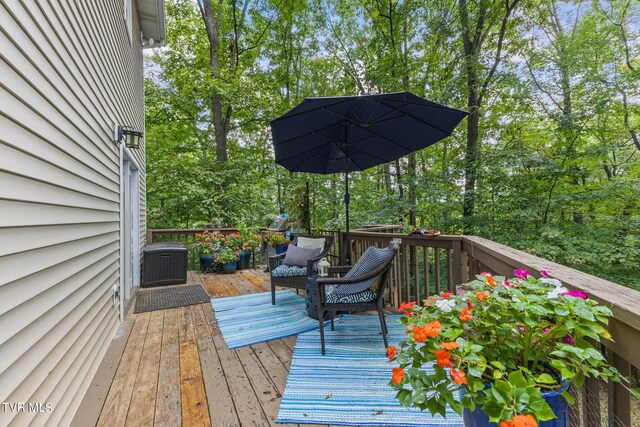 wooden terrace featuring central air condition unit