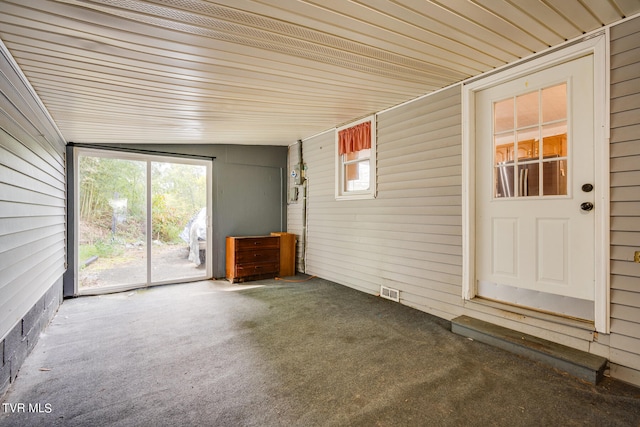 unfurnished sunroom with vaulted ceiling