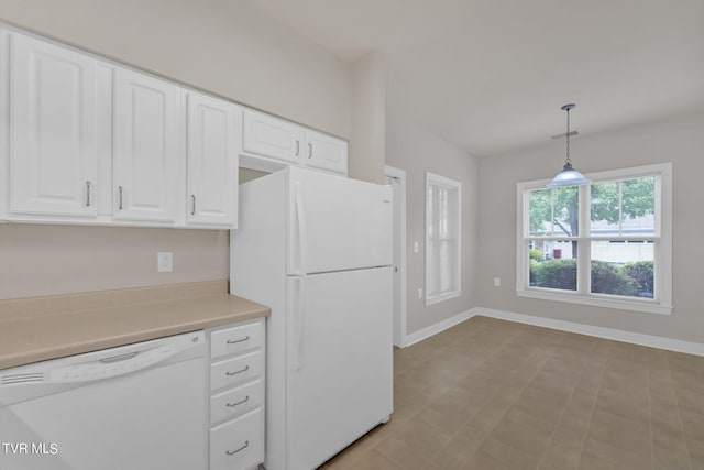 kitchen with pendant lighting, white appliances, and white cabinetry