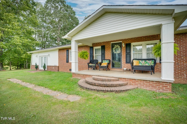 rear view of property with a lawn