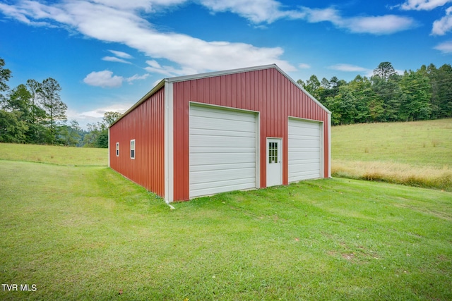 garage featuring a lawn