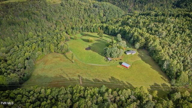 birds eye view of property with a rural view