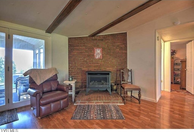 living room with wood-type flooring and beam ceiling