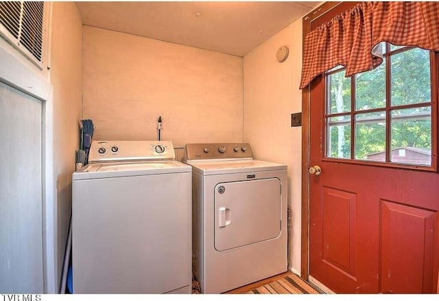 laundry room featuring separate washer and dryer