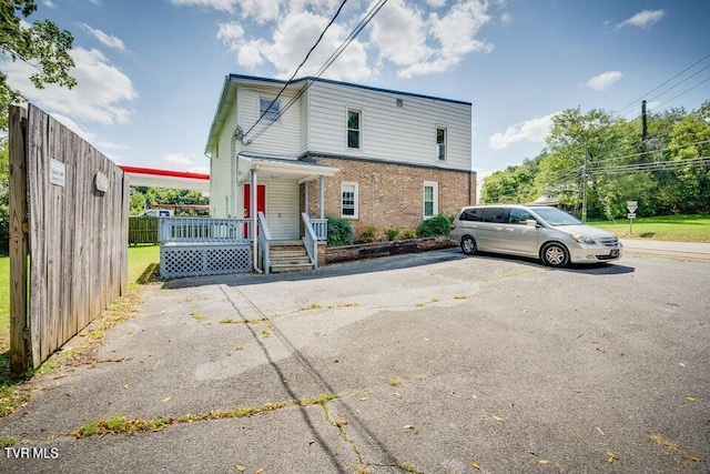 view of front of home featuring brick siding