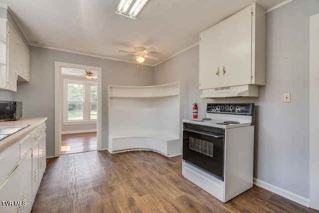 kitchen with white electric range, under cabinet range hood, dark wood-style floors, and black microwave