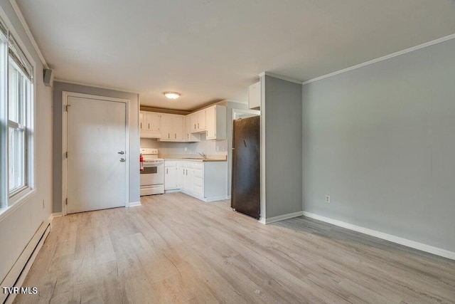 kitchen with a baseboard radiator, freestanding refrigerator, a sink, light wood-type flooring, and white range with electric stovetop