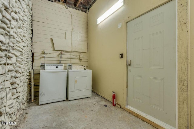 laundry area with washing machine and clothes dryer