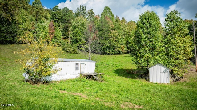 view of yard with a shed and an outdoor structure