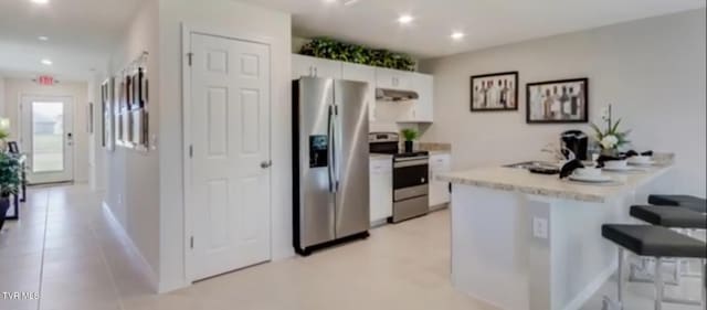 kitchen featuring white cabinetry, appliances with stainless steel finishes, sink, and extractor fan