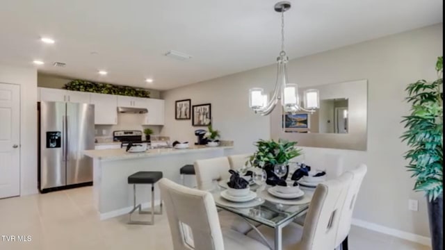 dining room with a chandelier