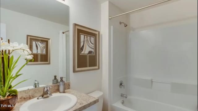 full bathroom with shower / washtub combination, toilet, and vanity