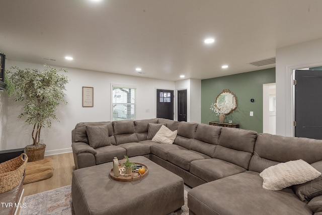 living room with light hardwood / wood-style flooring