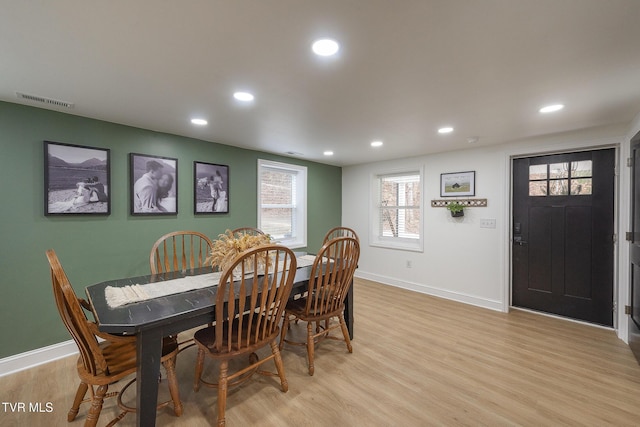 dining space featuring light wood-type flooring