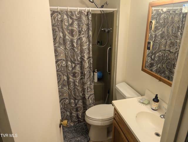 bathroom with vanity, a shower with curtain, and toilet