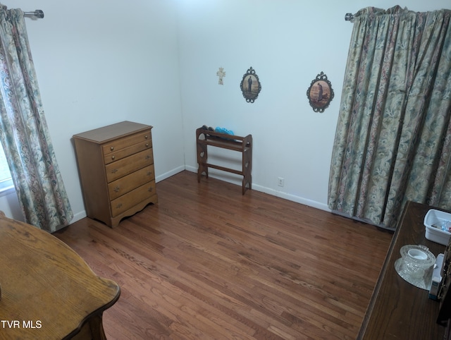 bedroom featuring dark hardwood / wood-style flooring