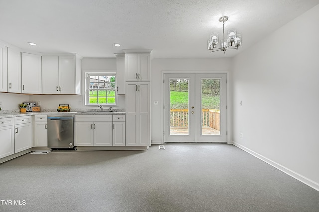 kitchen with white cabinets, dishwasher, sink, and a wealth of natural light