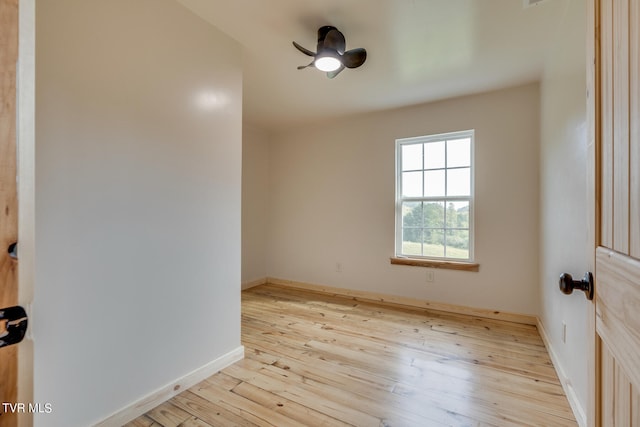 empty room featuring ceiling fan and light hardwood / wood-style flooring