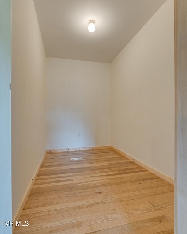 spare room featuring light hardwood / wood-style floors