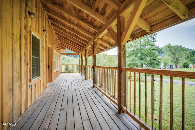 wooden terrace with a yard