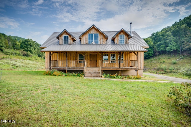 view of front of house with a front yard and a porch