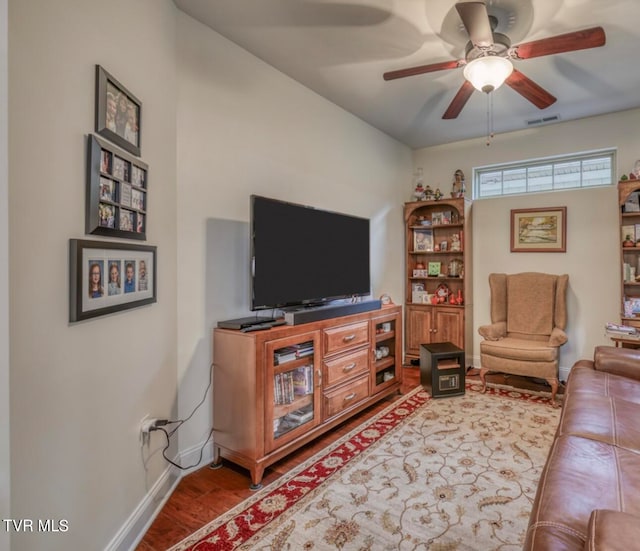 living room with hardwood / wood-style floors and ceiling fan