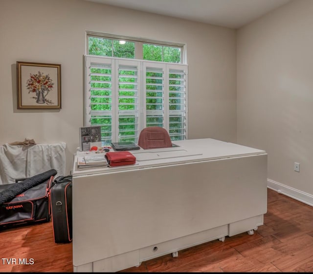 office space with light hardwood / wood-style flooring